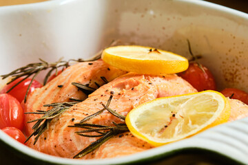 Salmon fish in baking dish