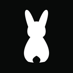 Silhouette of a white rabbit on a black background. Back view. Easter Bunny