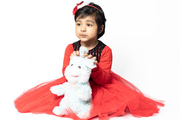 Cute Asian Indian Girl Playing With Soft Toy. Isolated On White Background. Fun, Activity, Kindergarten, Birthday, Engagement, Childhood, Leisure Pre School, Love, Tenderness Concept