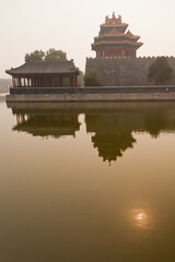 Forbidden City Corner Tower at sunset with reflection, Beijing, China