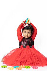 Happy Indian Pretty Girl Playing With Colorful Toys On White Background. Fun, Activity, Educational, Kindergarten, Birthday, Learning, Home Activity, School, Nursery, Daycare, Development Concept