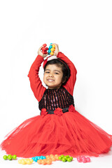Happy Indian Pretty Girl Playing With Colorful Toys On White Background. Fun, Activity, Educational, Kindergarten, Birthday, Learning, Home Activity, School, Nursery, Daycare, Development Concept