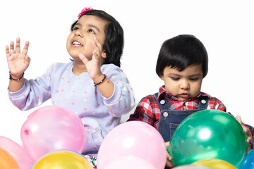 Asian Indian Girl And Boy Playing With Balloons. Fun, Activity, Educational, Kindergarten,...