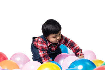 Fototapeta na wymiar Happy Asian Indian Toddler Boy Playing With Balloons. Fun, Activity, Pre School, Educational, Kindergarten, Birthday, Learning, Home Activity, School, Nursery, Daycare, Play, Physical Activity Concept