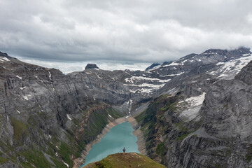 Obraz premium Amazing shot of a beautiful landscape in the alps of Switzerland. Wonderful flight with a drone over an amazing landscape in the canton of Glarus. Epic view over a lake called Limmerensee.