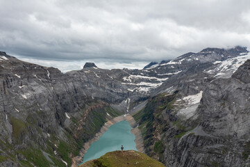 Amazing shot of a beautiful landscape in the alps of Switzerland. Wonderful flight with a drone over an amazing landscape in the canton of Glarus. Epic view over a lake called Limmerensee.