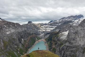 Amazing shot of a beautiful landscape in the alps of Switzerland. Wonderful flight with a drone over an amazing landscape in the canton of Glarus. Epic view over a lake called Limmerensee.