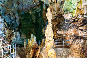 Crimea, Ukraine. Stalactites, stalagmites on the walls of the Emine-Bair-Khosar cave. Template for design. Selective sharpness.
