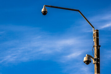 outdoor video surveillance camera , dome security camera on the street in downtown Sao Paulo city,...