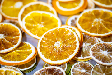 dried citrus fruits on a grey metallic background, space for text. High quality photo