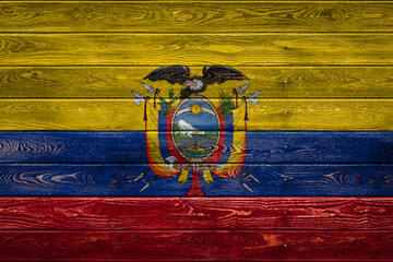 The national flag of Ecuador is painted on a camp of even boards nailed with a nail. The symbol of the country.