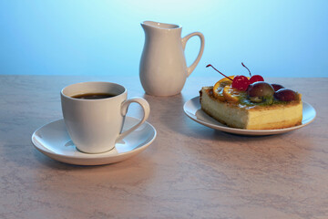 a cup of tea and a piece of delicious cake on a light wooden background