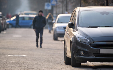 Close up of a car parked illegally against traffic rules on pedestrian city street side