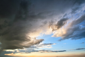 Obraz premium Landscape of dark clouds forming on stormy sky during thunderstorm