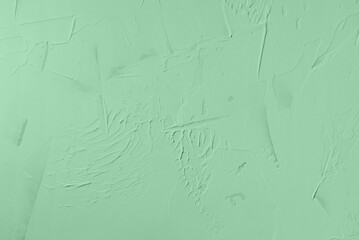 Light green decorative painted plastered wall texture as background
