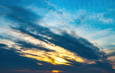 blue sky with spindrift clouds at sunset