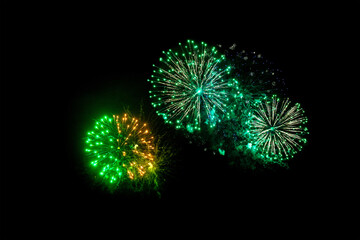 green fireworks on a black background. Festive Christmas lighting element for decoration. Sparks....