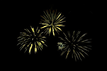 yellow fireworks. Bright festive fireworks for birthday, holiday or Christmas on a black...