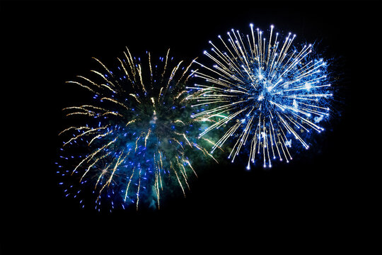 blue fireworks on a black background. Festive Christmas lighting element for decoration. Sparks. Fireworks Are A Class Of Explosive Pyrotechnic Devices Used For Aesthetic Purposes. Isolated 