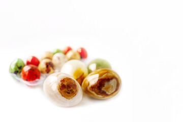 colored onyx spheres isolated on a white background. Easter eggs made of natural onyx gemstone. Fashionable organization of the spring holiday. Minimalistic flat styling.
