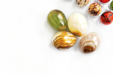 colored onyx spheres isolated on a white background. Easter eggs made of natural onyx gemstone. Fashionable organization of the spring holiday. Minimalistic flat styling.