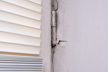 Peeling old paint on window slopes needed to be repared and repainted, reconstruction concept