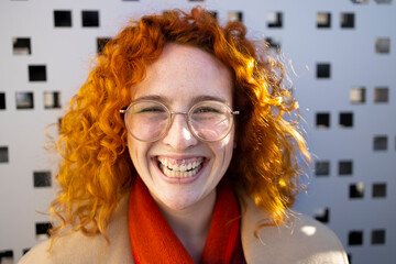 Portrait of a young hipster with a piercing smiling
