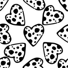 Black heart pattern with texture dots of different sizes on white. A seamless pattern of a hand-drawn isolated heart with dots inside, randomly arranged on white in the style of doodles for a design t