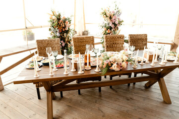 food on the wedding table. wedding catering. decor and floristry at the wedding banquet. fast food on the table in plates. wedding table setting with food