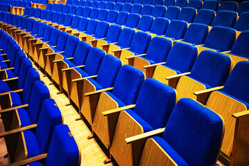 Naklejka premium auditorium without people with blue chairs