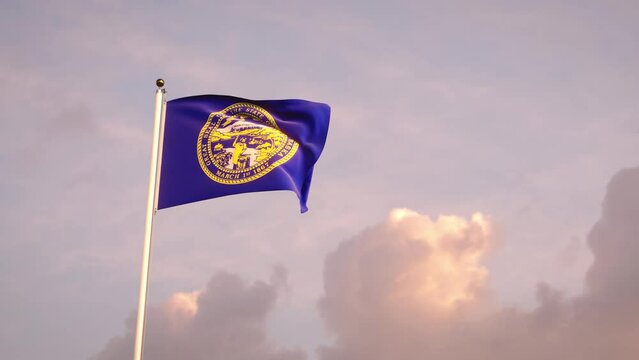 Nebraska flag fluttering with sky background. 4k 3d render.