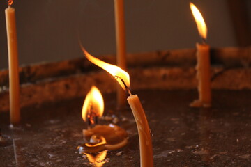 burning candle in the dark