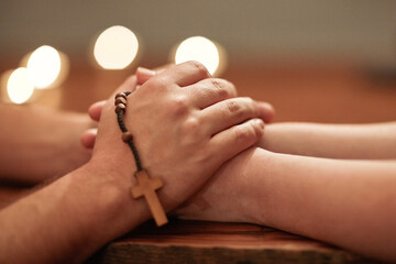 Overcoming anything with good friends and good faith. Cropped shot of two people holding hands and...