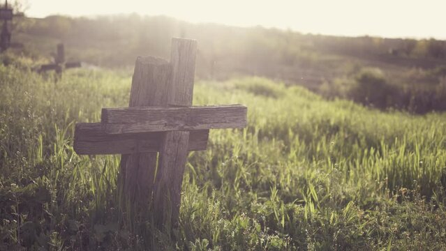 Couple of two christian cross, warms sun light at sunset, love after death