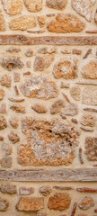background, texture - rough masonry from wild stone and cement on a wooden frame