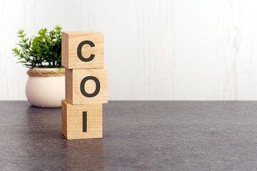 word coi made with wood building blocks