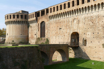 Sforza Castle in Imola, the wooden drawbridge with chains over the moat in front of the main entrance door