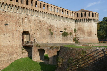 Sforza Castle in Imola, the wooden drawbridge with chains over the moat in front of the main entrance door