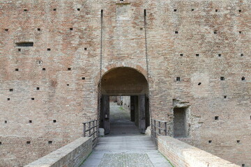 Sforza Castle in Imola, the wooden drawbridge with chains over the moat in front of the main...