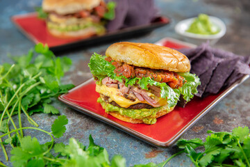 Ham and Cheese Breakfast Burger on top Guacamole