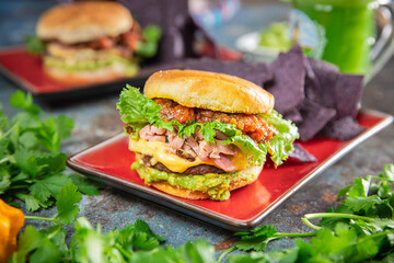 Ham and Cheese Breakfast Burger on top Guacamole