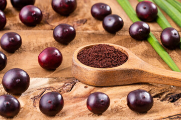 Acai berry powder in spoon - Euterpe oleracea