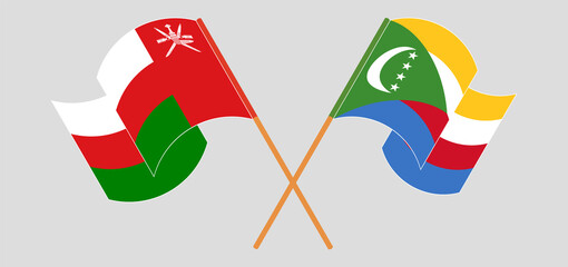 Crossed flags of Oman and the Comoros. Official colors. Correct proportion