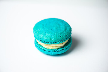 Colorful macarons cake, top view flat lay, fly falling sweet macaroon on color white isolated background. Minimal concepts falling macaroons pattern above, food natural background