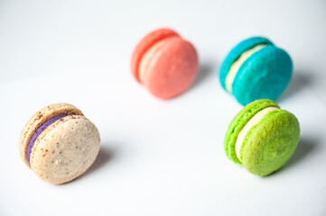 Sweet colorful macarons isolated on white background. Tasty colourful macaroons. High quality photo