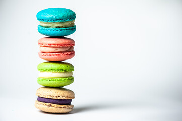 Sweet colorful macarons isolated on white background. Tasty colourful macaroons. High quality photo