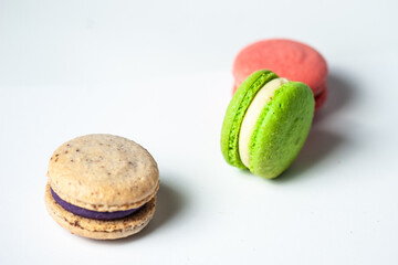 Sweet colorful macarons isolated on white background. Tasty colourful macaroons. High quality photo