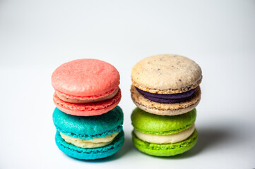 Sweet colorful macarons isolated on white background. Tasty colourful macaroons. High quality photo