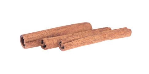three cinnamon sticks isolated on white background