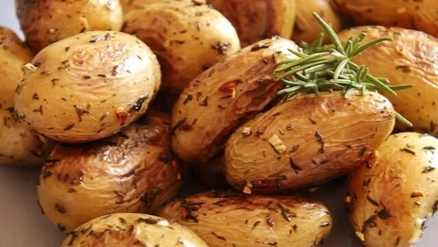 shot potato close-up with garlic and rosemary